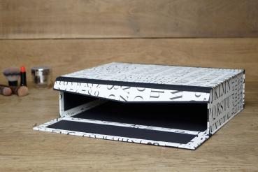 Box with typography, hinged lid and front, black inside, edges with black linen